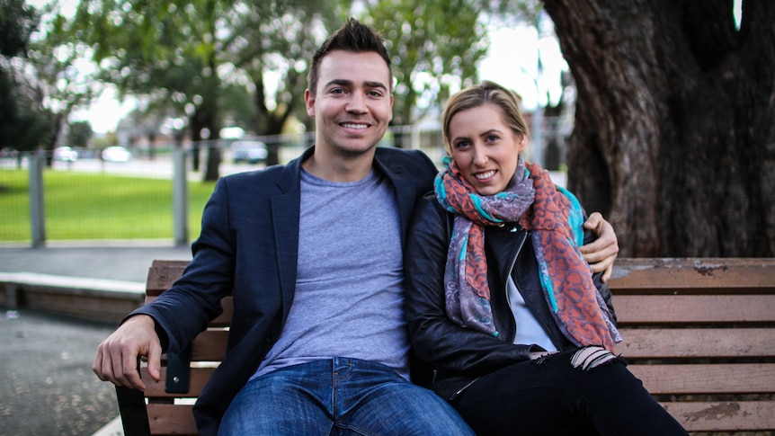 Eat Up founder Lyndon Galea has his arm around his girlfriend Belinda Luke sitting on  park bench.