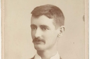 Sepia portrait of a young Henry Lawson.
