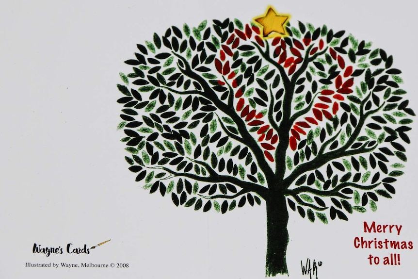 A drawing of a tree with a star on top on a Christmas card.