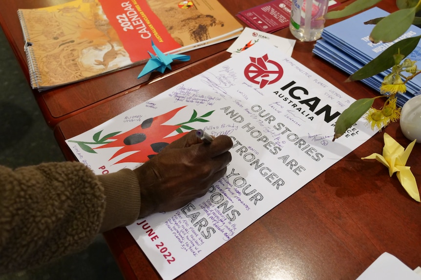 a man signing a document