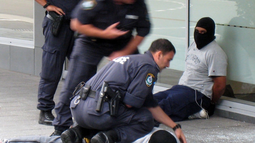 Police arrest two armed bank robbers in Sydney