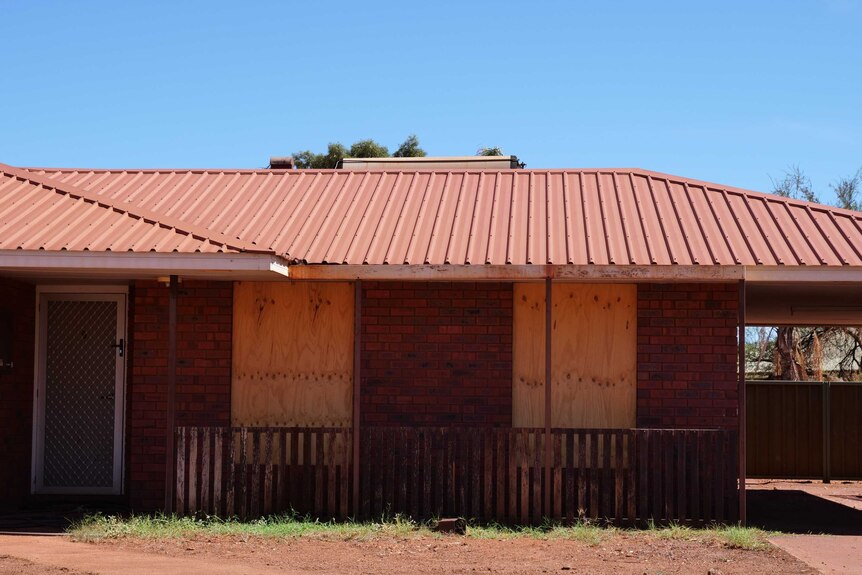 An image of a boarded up property in Newman, WA.