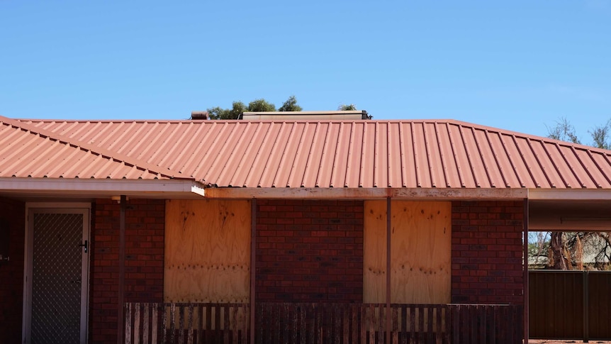 An image of a boarded up property in Newman.