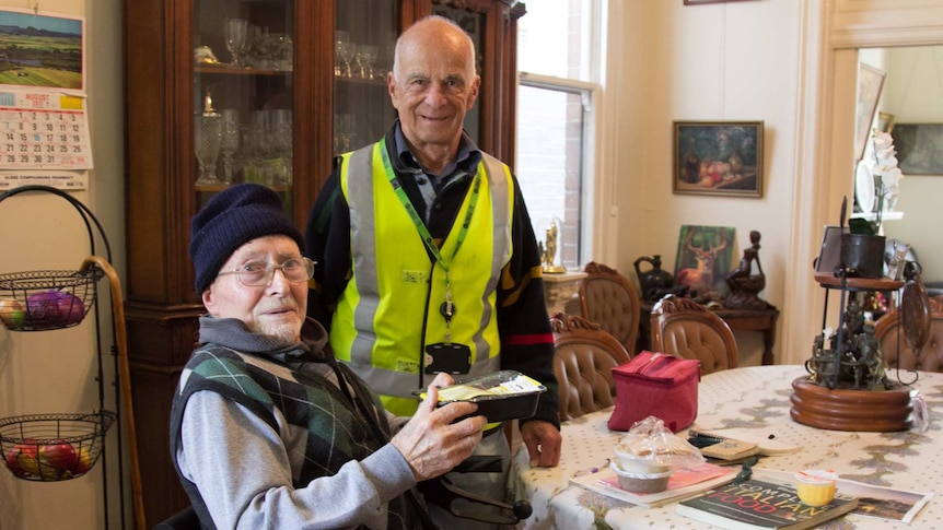 Meals on Wheels volunteer John Karlick with Glebe resident Sergio Ferrari