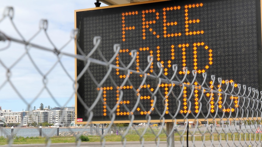 An electronic sign saying Free COVID testing.