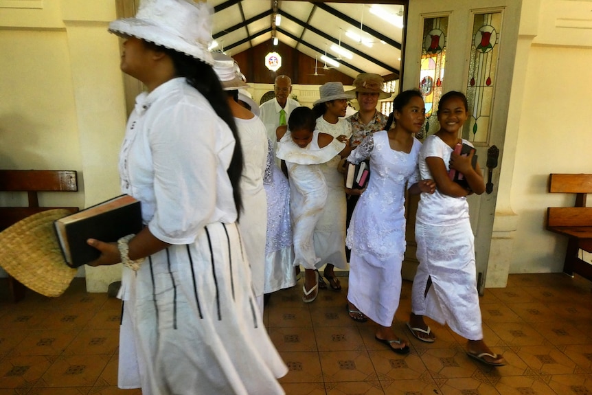 People leave church in their Sunday best