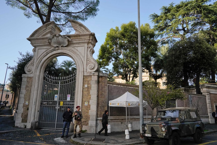 Soldiers and police officers guard the Vatican's embassy to Italy, at the Apostolic Nunciature in Rome.
