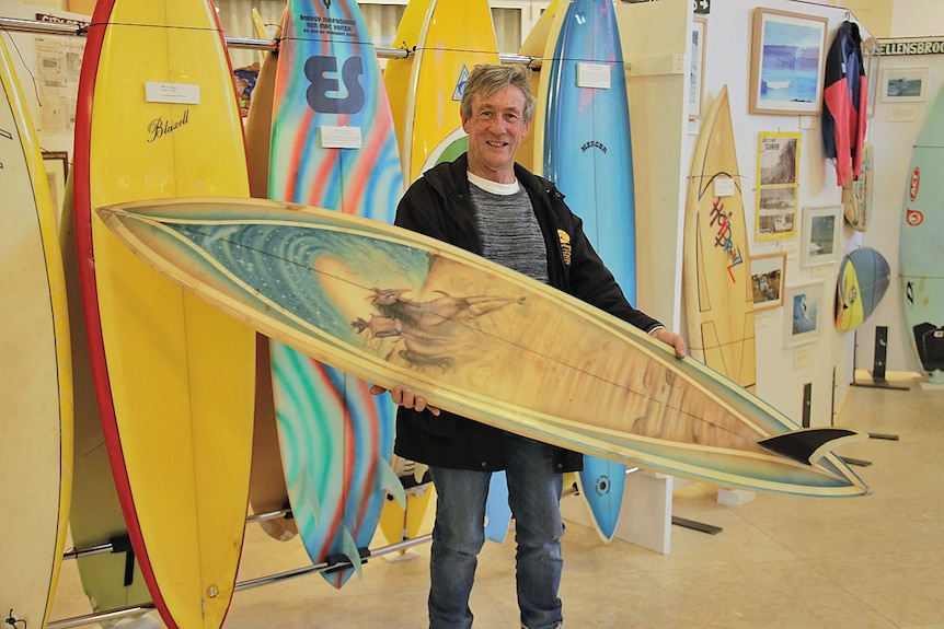 Bill Gibson with the recovered surfboard