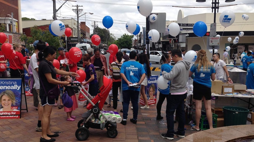 Liberals and Labor supporters campaign at the Eastwood Mall in Bennelong.