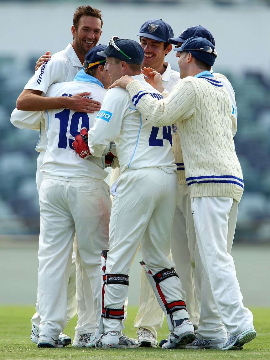 Comfortable win ... The Blues celebrate the wicket of Mitchell Marsh
