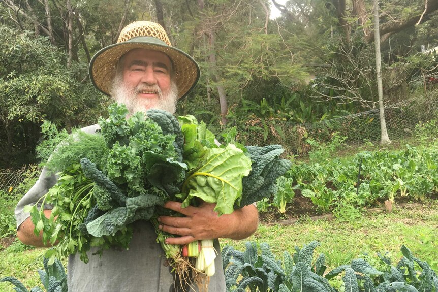 Stu Venn posing with some of his no dig farming produce.