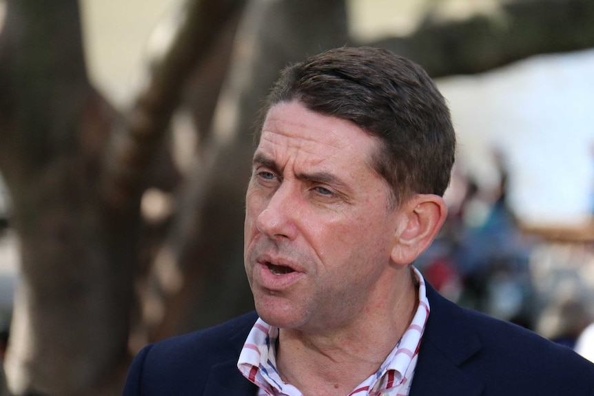 Cameron Dick talking to media during a press conference in South Bank