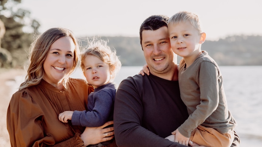 A young family on the beach.