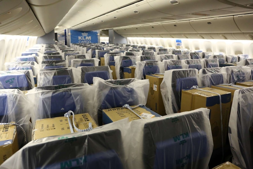 Photo of a KLM passenger flight filled with cargo instead of people.