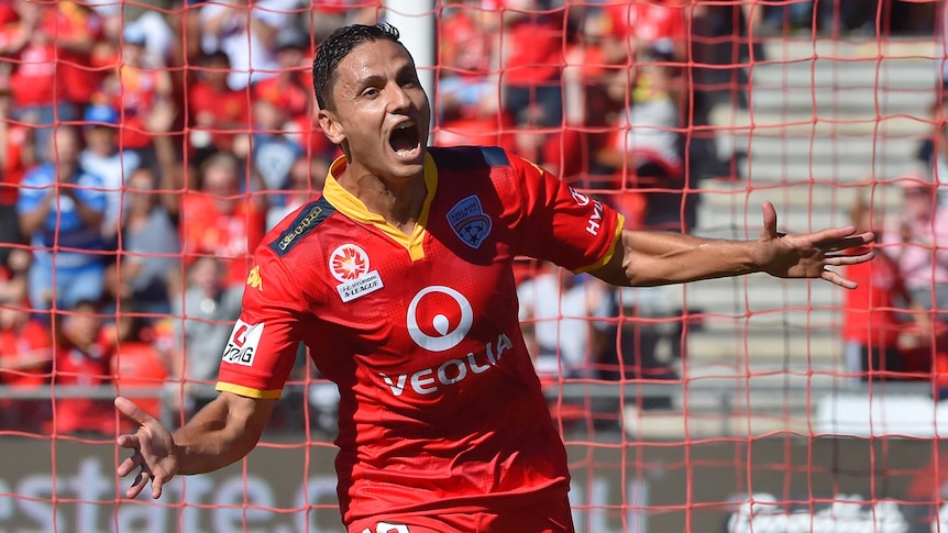 Marcelo Carrusca celebrates his goal for Adelaide United against Newcastle