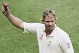 Shane Warne leaves the field after taking his 700th Test wicket
