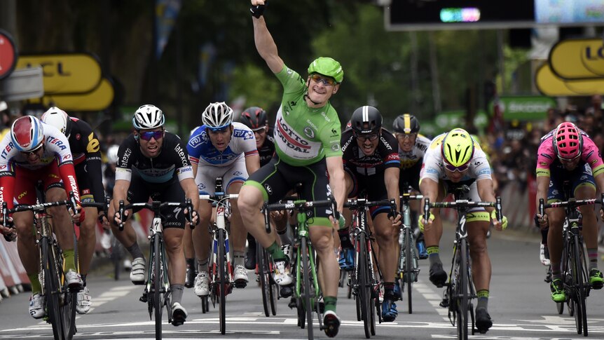 Germany's Andre Greipel, wearing the green jersey, wins stage five of the 2015 Tour de France.