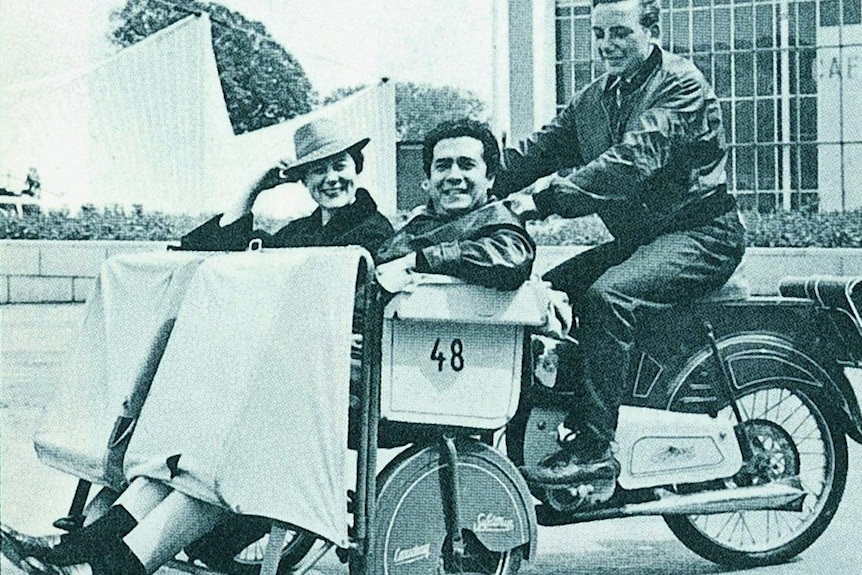 Italian soprano Renata Tebaldi and Italian tenor Giuseppe Di Stefano ride a motorised tricycle.