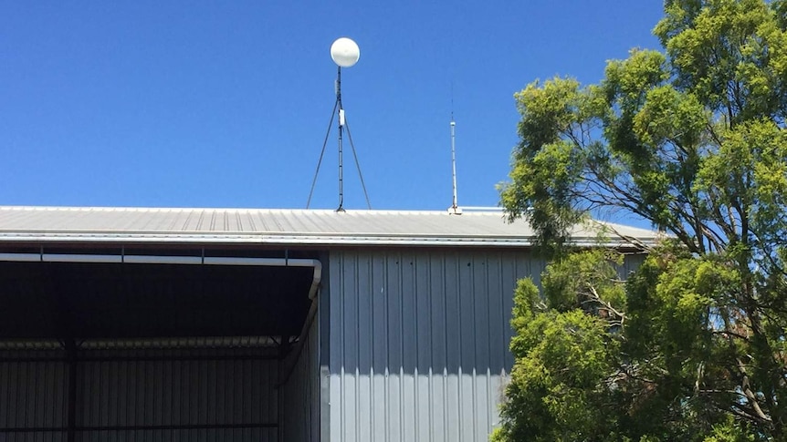 A dish installed on top of a farming shed at Bowenville near Dalby