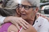 Christine Archer embraces her younger sister Gail Baker when they were reunited in Bowraville this week.