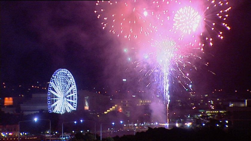 New year's eve firework display in Brisbane city, with South Bank's Eye wheel on Dec 31, 2008