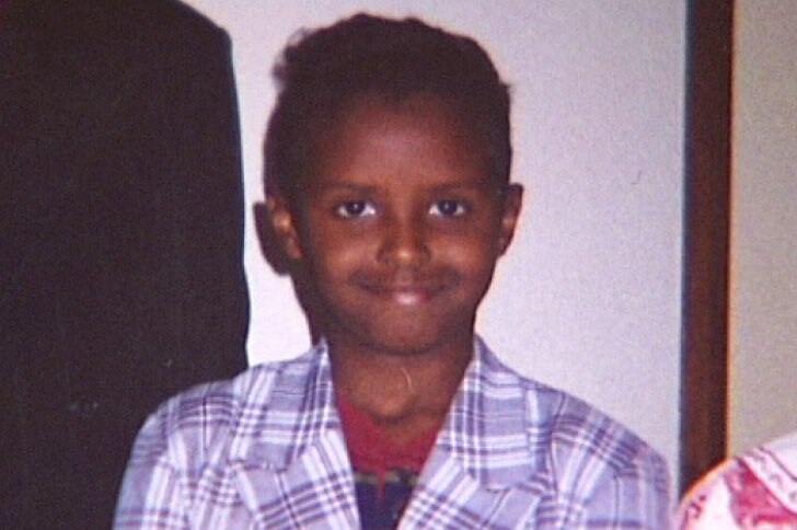 A smiling photo of  Yacqub Khayre as a young boy.