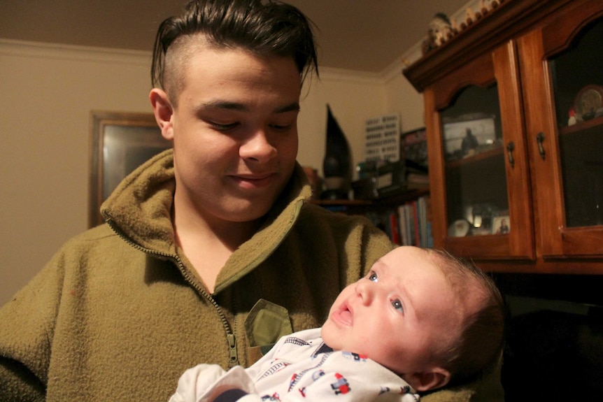 Kirsten's two sons: 18-year-old TJ holds baby Lachlan