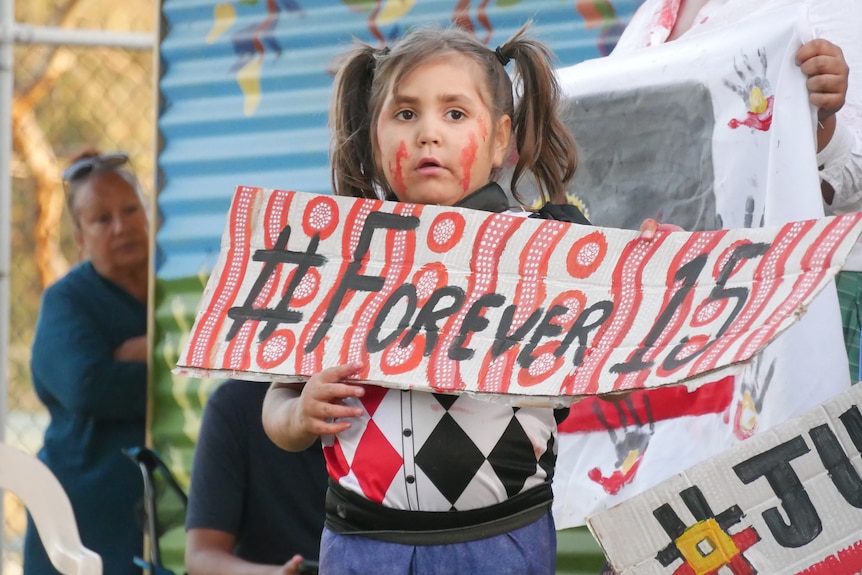 Geraldton children dressed in Halloween costumes waved signs