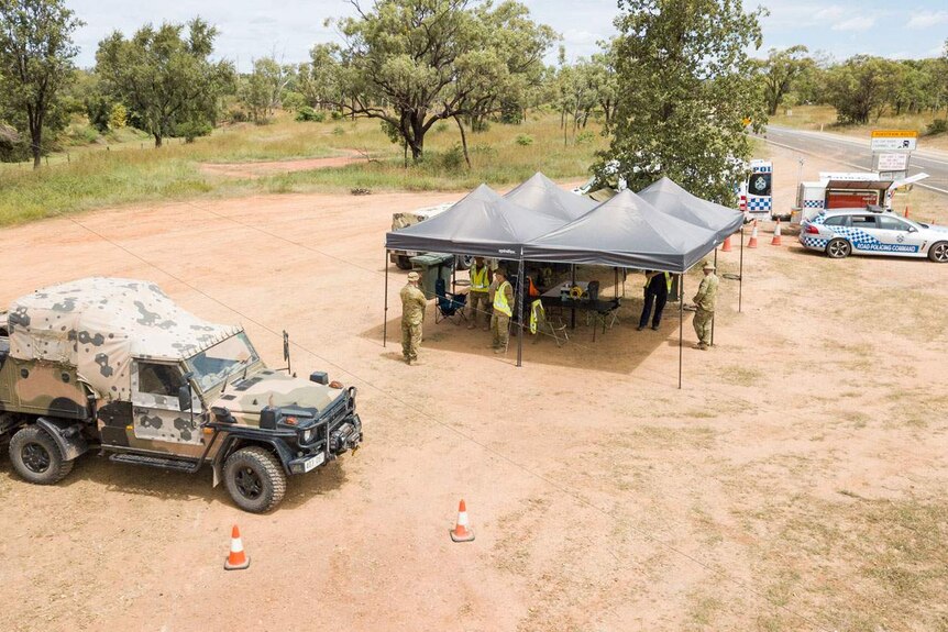 Australian Defence Force soldiers assist police at roadside post in North Queensland during the coronavirus response.