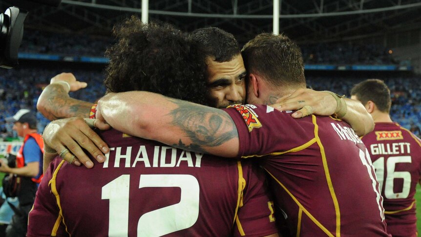 Sam Thaiday, Greg Inglis and Chris McQueen celebrate winning the State of Origin decider