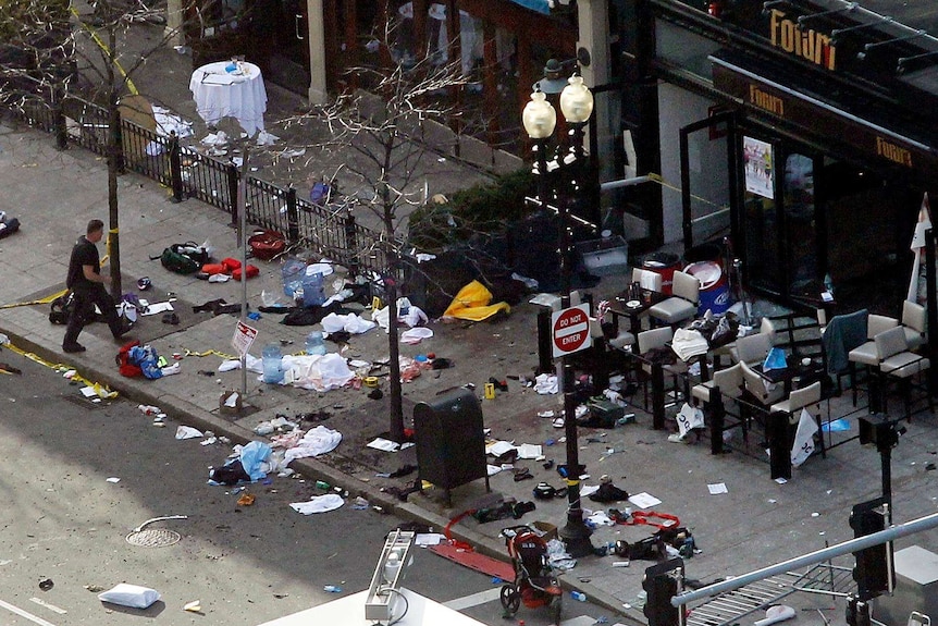 Debris lays strewn in front of shops after explosions.