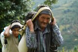 Villagers carry supplies to Bigu, Nepal