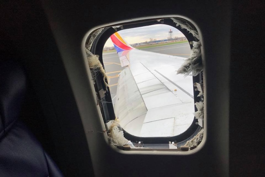 A window is blown on Southwest Airlines