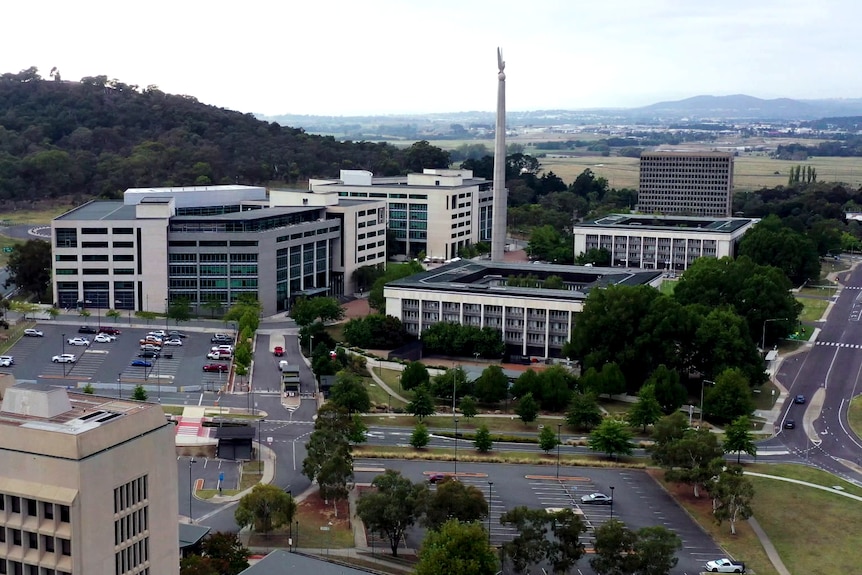 A drone image of a number of buildings and nearby roads.