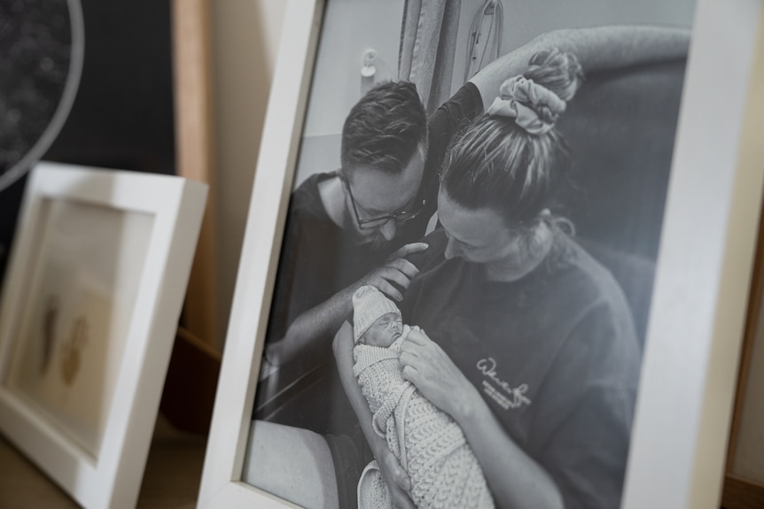 Sophie and Nathan Streeter cradle their late son Charlie in a framed black-and-white photograph.