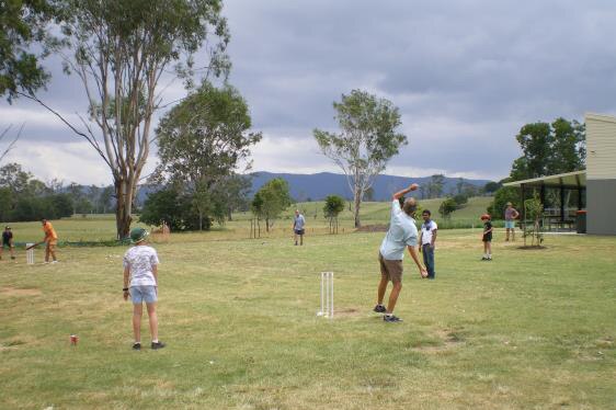 Bangladeshi asylum seekers play cricket in Kilcoy.