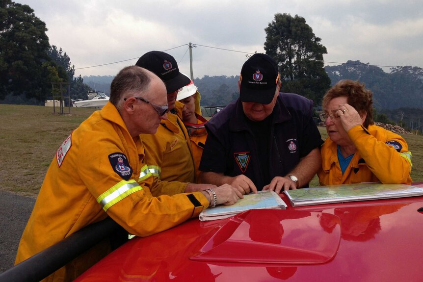 Crews look at maps of Lefroy fire in Northern Tasmania.