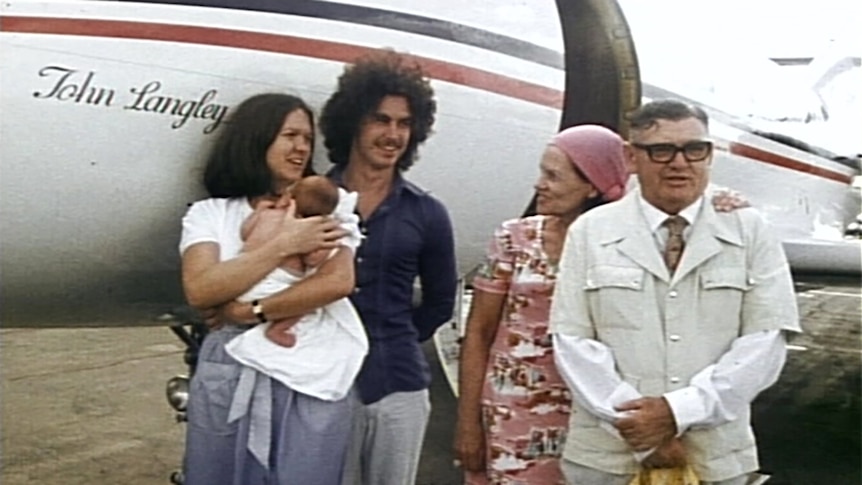 The Hancock family in front of a small aircraft