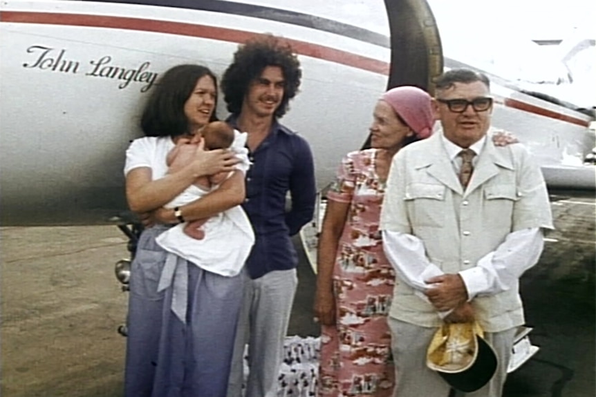 The Hancock family in front of a small aircraft