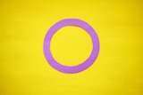 A light purple hollow circle on a background of lemon yellow.