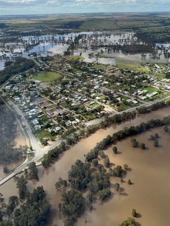 An image from the air looking down on a regional town surrounded by floodwaters.