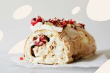 Photograph of a rolled meringue with cream and berries, in a collect of best main, salad and dessert recipes to make this summe.