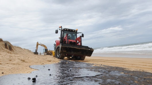 Oil has caked about 60 kilometres of beaches along the coast.