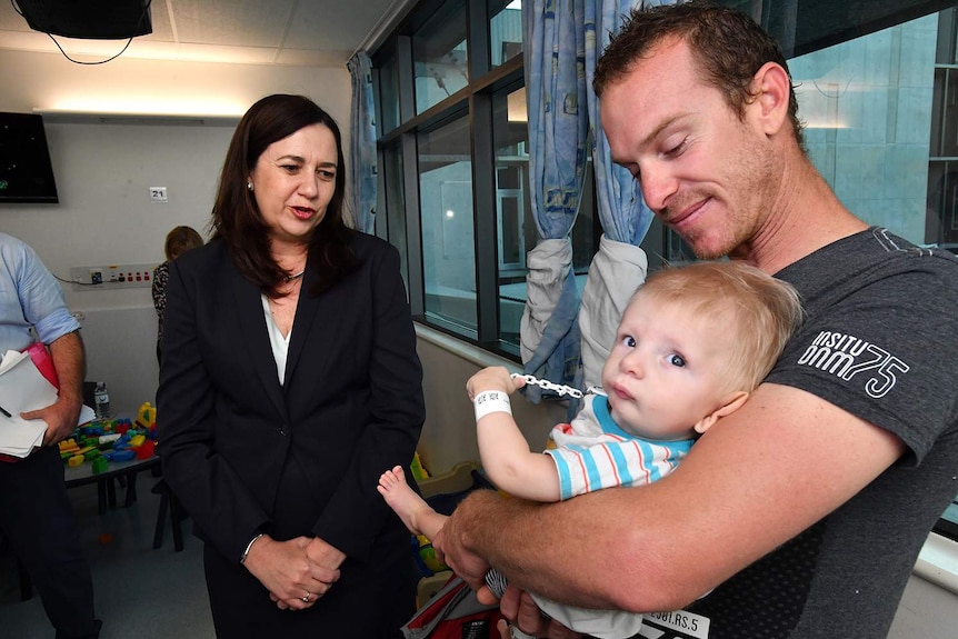 Premier Annastacia Palaszczuk talking to patients in the children's ward at the Townsville Hospital.