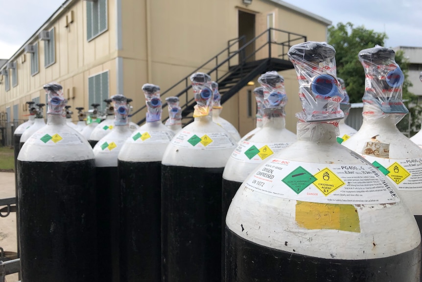 Oxygen tanks outside a building.