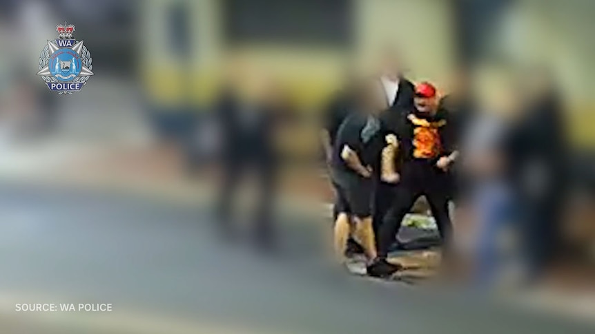 CCTV vision of a man who punches another man, once in the torso and again in the head, who then hits the ground.