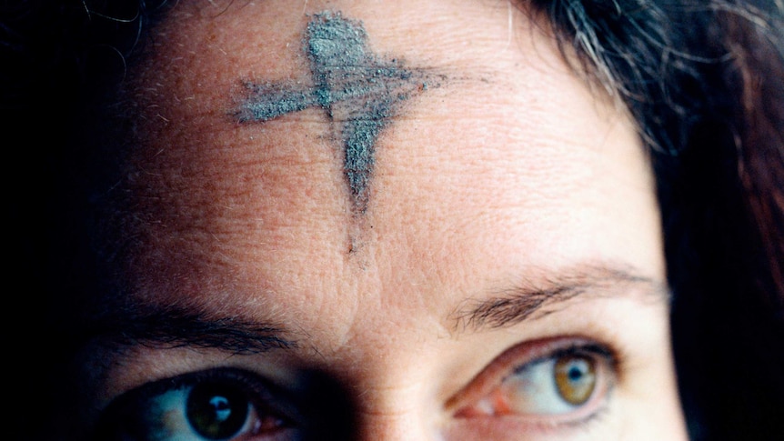 Woman with cross on forehead for Lent