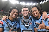 Brian To'o, Nathan Cleary and Jarome Luai stand in a line, hugging