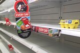 A single carton of eggs on a supermarket shelf.
