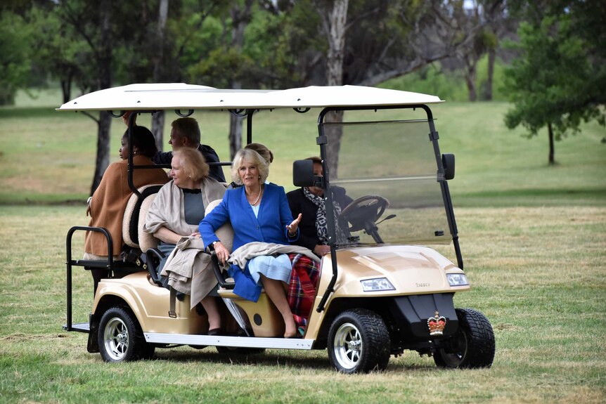 The Duchess of Cornwall in a golf cart at Government House